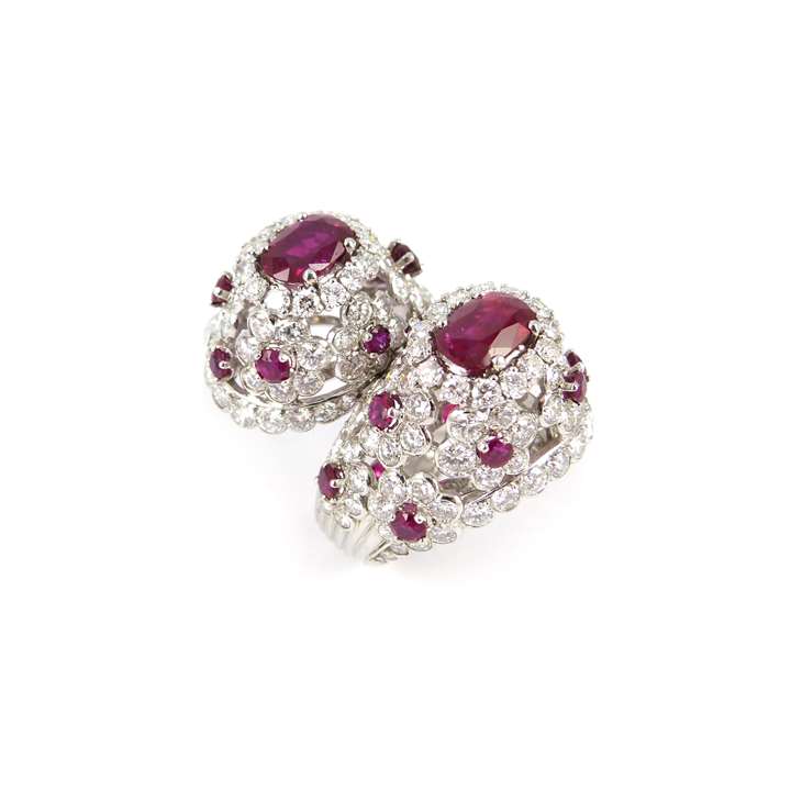 Two stone ruby and diamond cluster crossover ring